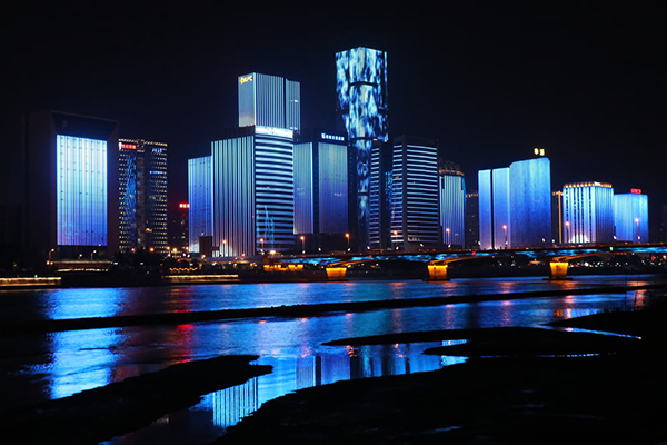photography of lighted buildings reflecting on water.jpg